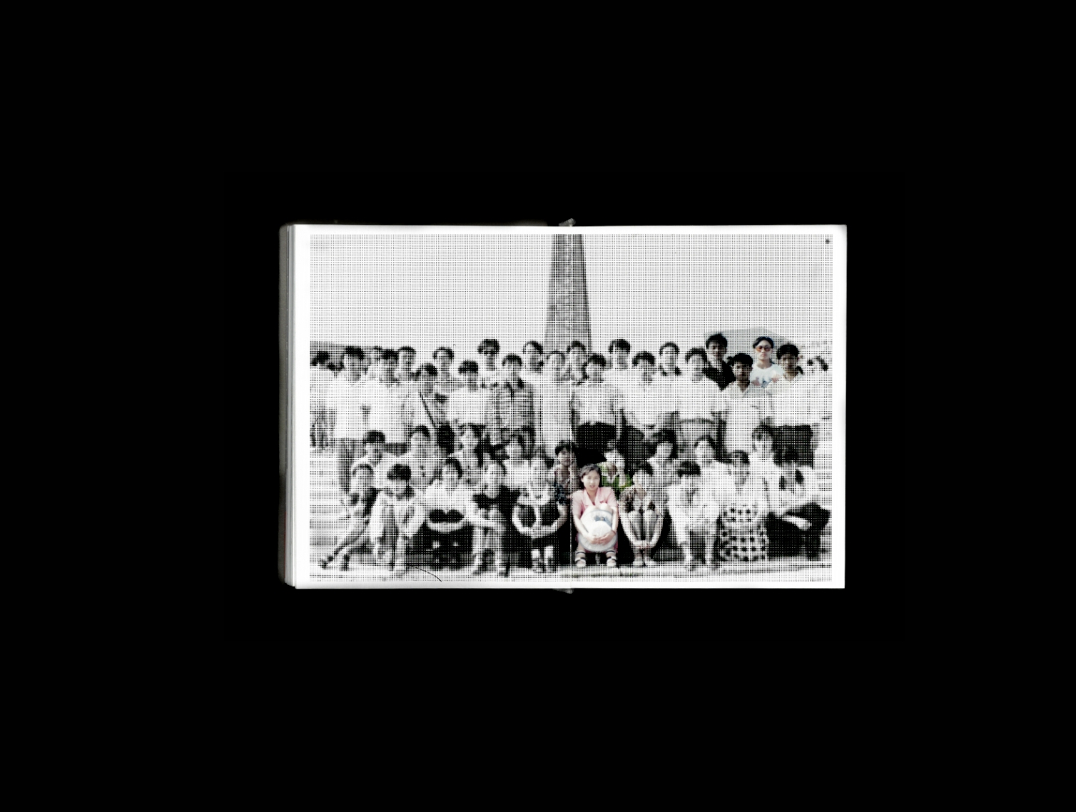 Artist book spread containing a composite family portrait